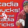 Man holding Stadia Controllers as Nunchucks